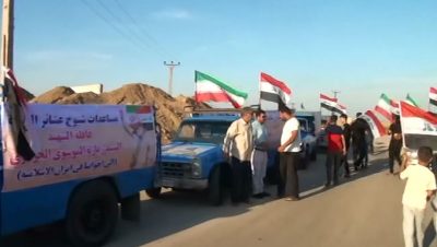 قوافل المساعدات العراقية تصل مدینة الحویزة لمساعدة منكوبي السيول